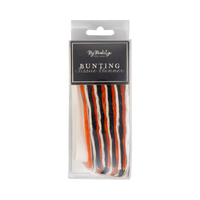 Packaged bunting tissue banner with red, white, and black colors on a transparent packaging.