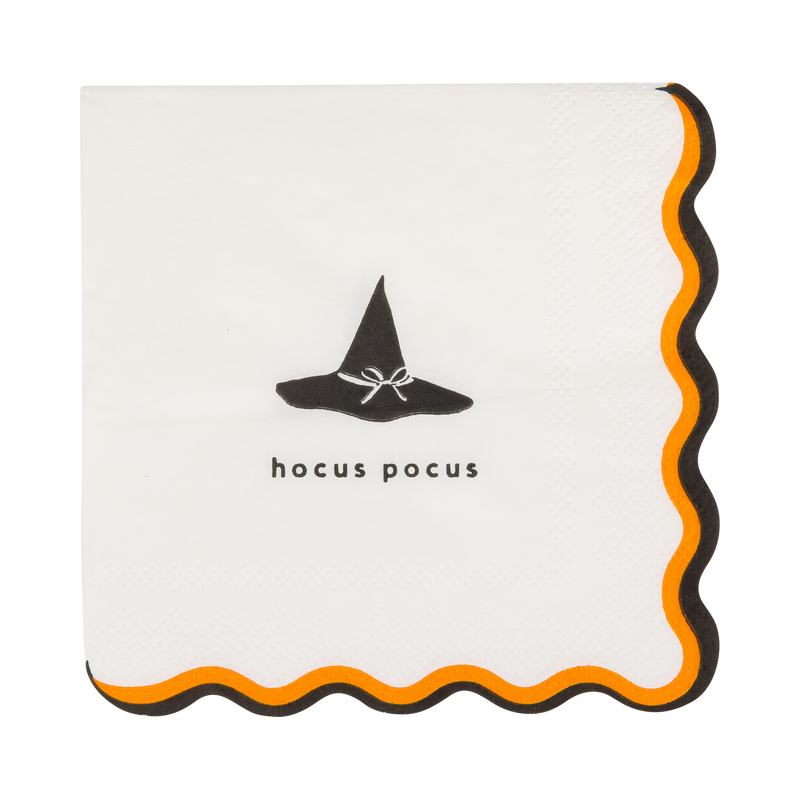 Halloween cocktail paper napkin with "Hocus Pocus" lettering, witch hat illustration, and black and orange wavy border.