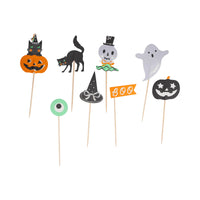 Halloween-themed cupcake toppers on sticks with various designs including a cat, ghost, and witch hat.