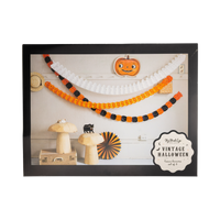 Halloween-themed decorative garland with pumpkins and black cats on a clear packaging.