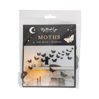 Halloween moth wall decor packaging — clear bag with "MOTHS" header card showing black gold-foil moths inside.
