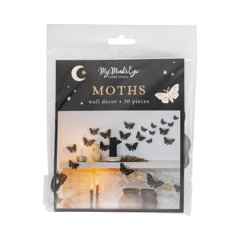 Halloween moth wall decor packaging — clear bag with "MOTHS" header card showing black gold-foil moths inside.