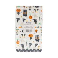 Pack of Halloween-themed paper napkins with ghost, pumpkin, and witch designs on a white background.