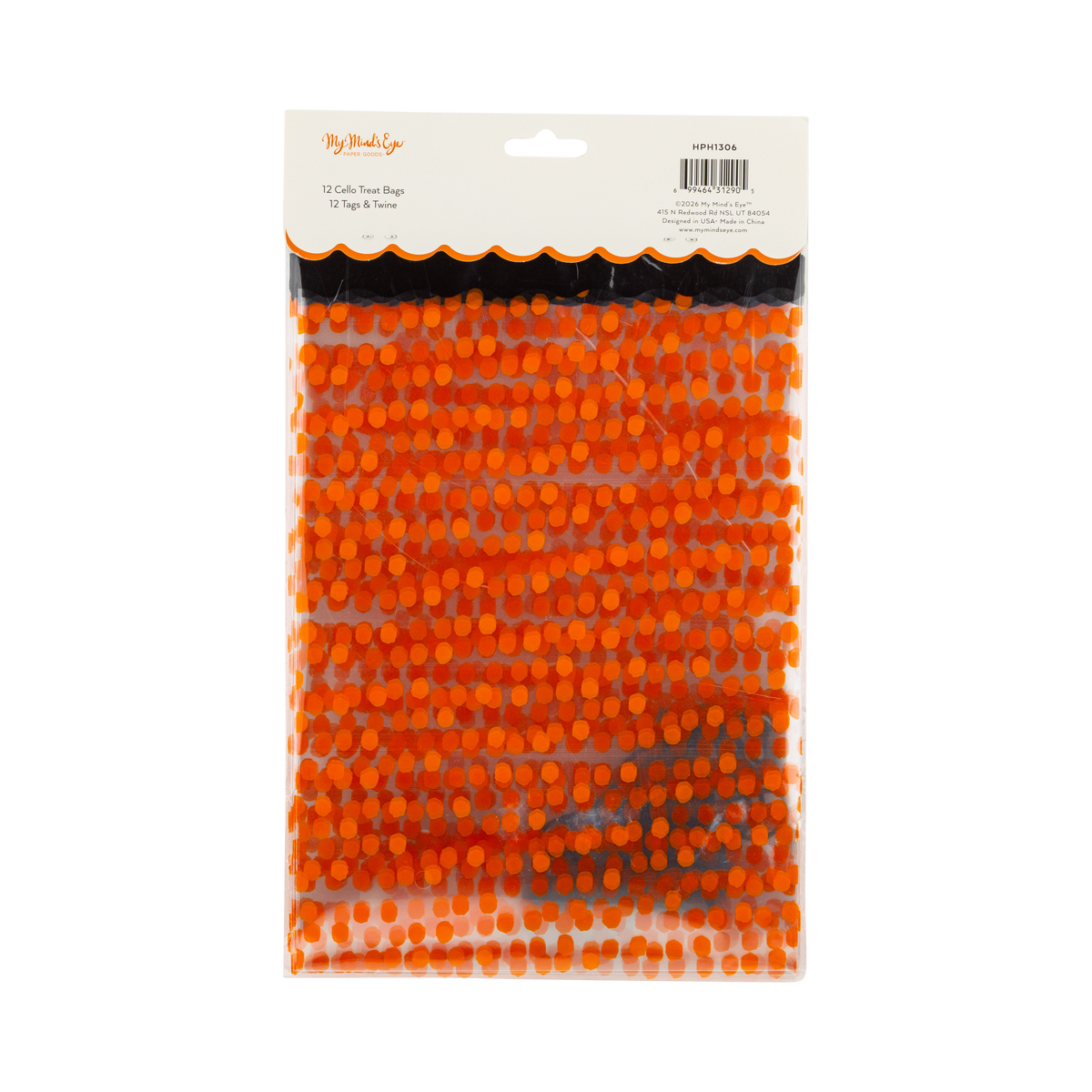 Orange polka dot cello treat bags packaged as Halloween party favors.