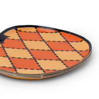 Stack of 8 die-cut harlequin pumpkin paper plates showing the black rim and pumpkin shape