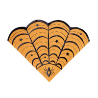 Orange spider web shaped paper napkin die-cut into a web with black lines, stars and a spider at the base