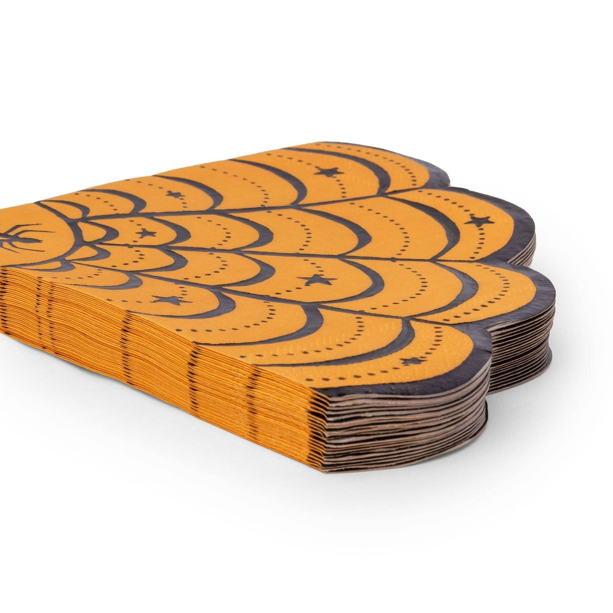 Stack of 20 die-cut spider web Halloween napkins showing the scalloped edge and layered web shape