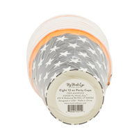 Stack of party cups with star pattern and visible brand label on a clear packaging, bottom view.