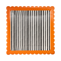 Halloween square paper plate with black-and-cream vertical stripes and an orange scalloped edge, overhead flat-lay view on gray background.