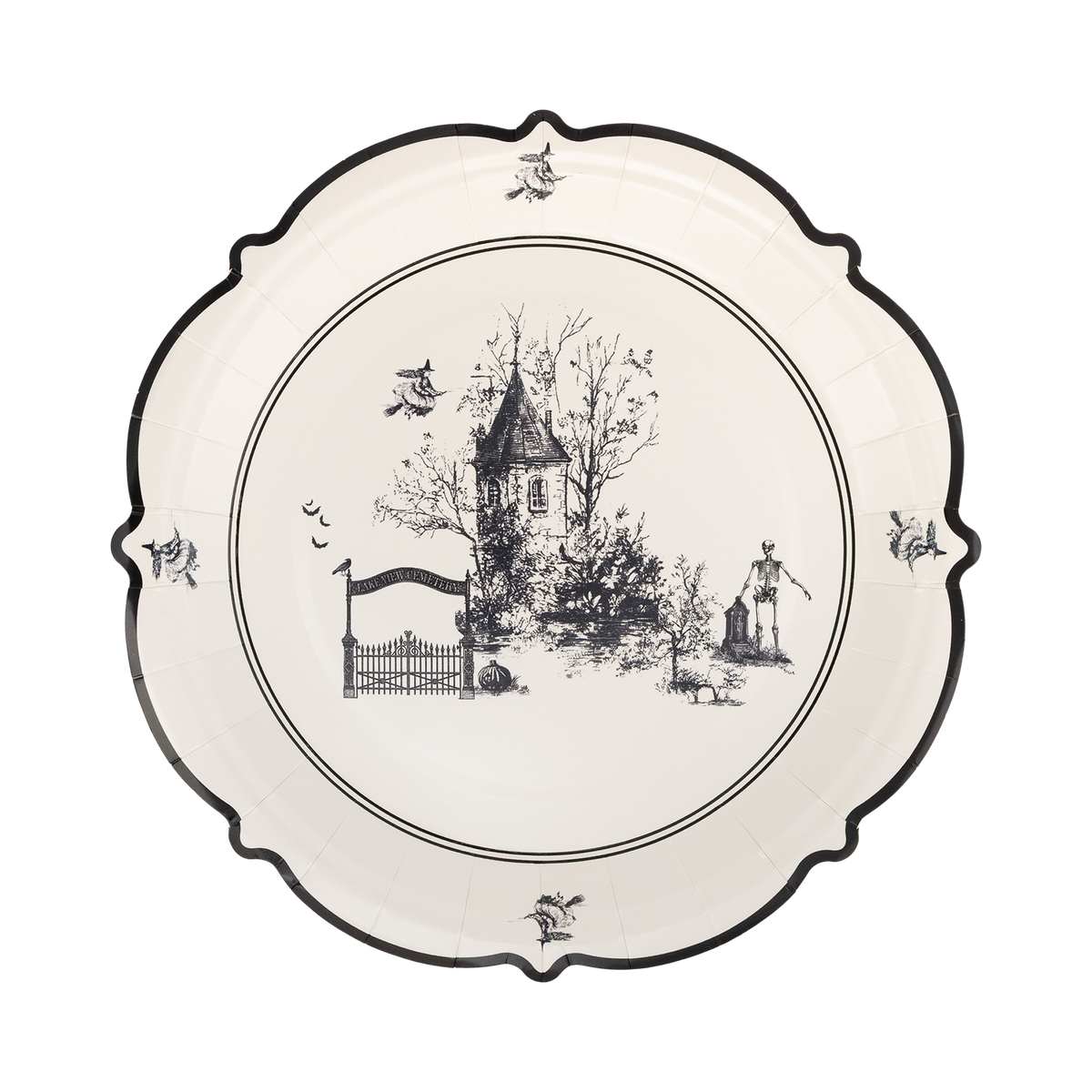 Decorative plate with black and white design of a house and trees on a white background