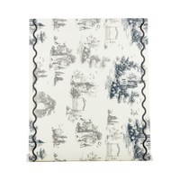 Cream paper table runner with black Halloween toile illustrations, shown flat to display the full pattern.