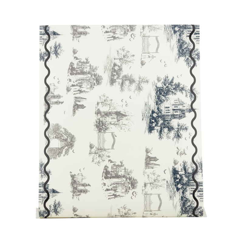 Cream paper table runner with black Halloween toile illustrations, shown flat to display the full pattern.