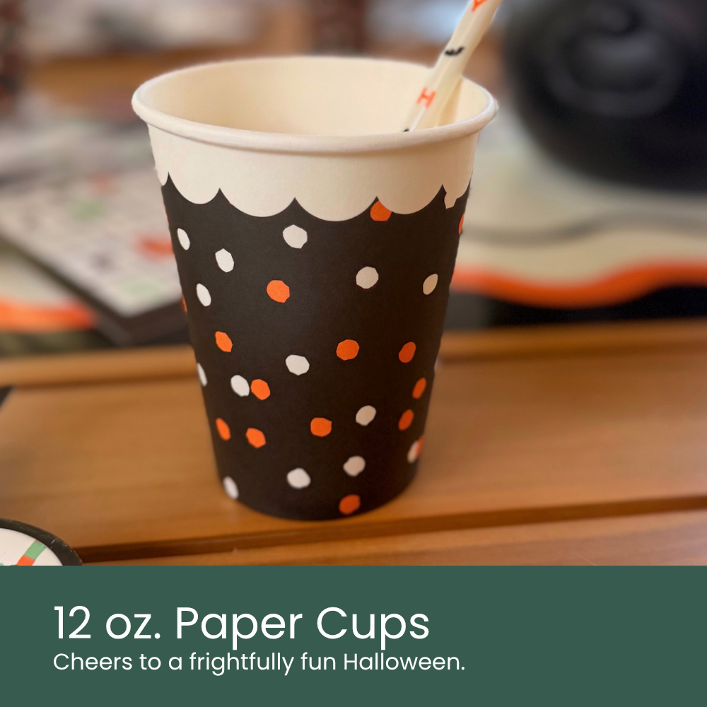 Moment & Co's Vintage Halloween Subscription Box - 12 oz. Paper Cups with white rim, black body, and orange and white polka dot design.
