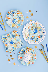Festival of lights Hanukkah napkins styled on a blue table with star plates