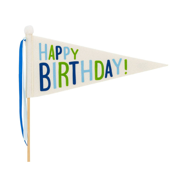 Happy Birthday felt pennant flag on wooden dowel with blue scalloped edge and blue and green satin ribbons on white background