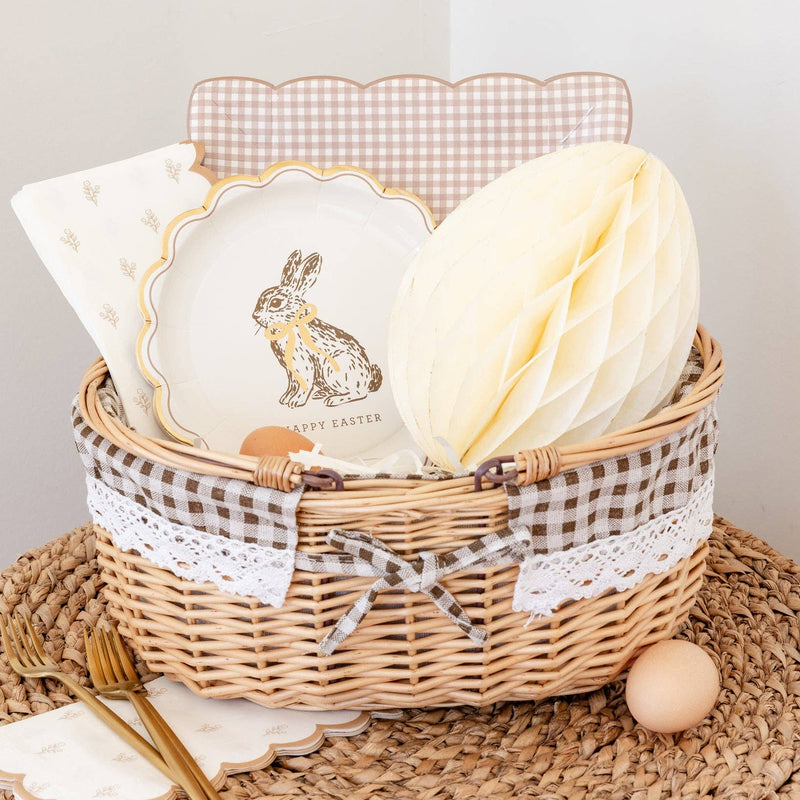 Happy Easter bunny plate styled in a basket with coordinating Easter tableware and decor