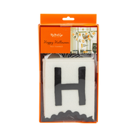 Front of the Happy Halloween felt banner package showing the layered felt letter "H" through a clear window with the My Mind's Eye label.
