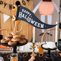 Happy Halloween felt pennant styled in a dessert-table centerpiece with seasonal party decor.