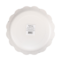 Back of the paper plate showing the plain cream scalloped shape and packaging label.