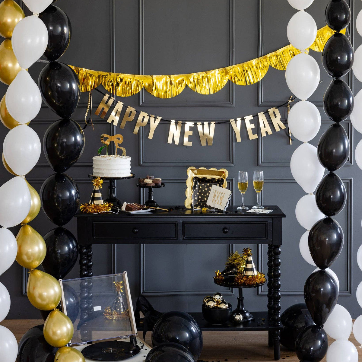 New Year celebration setup with balloons and Happy New Year banner