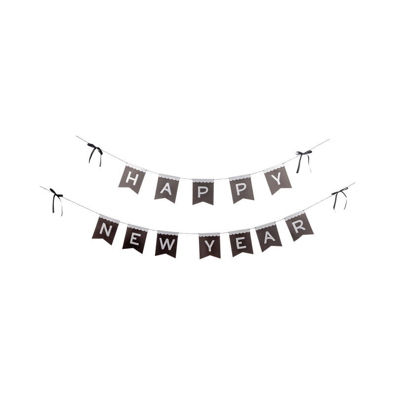 Silver glitter Happy New Year black paper banner laid out flat