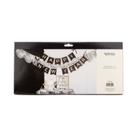 Silver glitter Happy New Year paper banner shown in back packaging