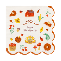 Harvest icons cocktail napkin with Happy Thanksgiving letters, cheerful fall art and a wavy orange edge, front view.