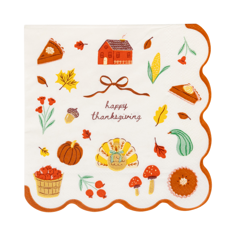 Harvest icons cocktail napkin with Happy Thanksgiving letters, cheerful fall art and a wavy orange edge, front view.