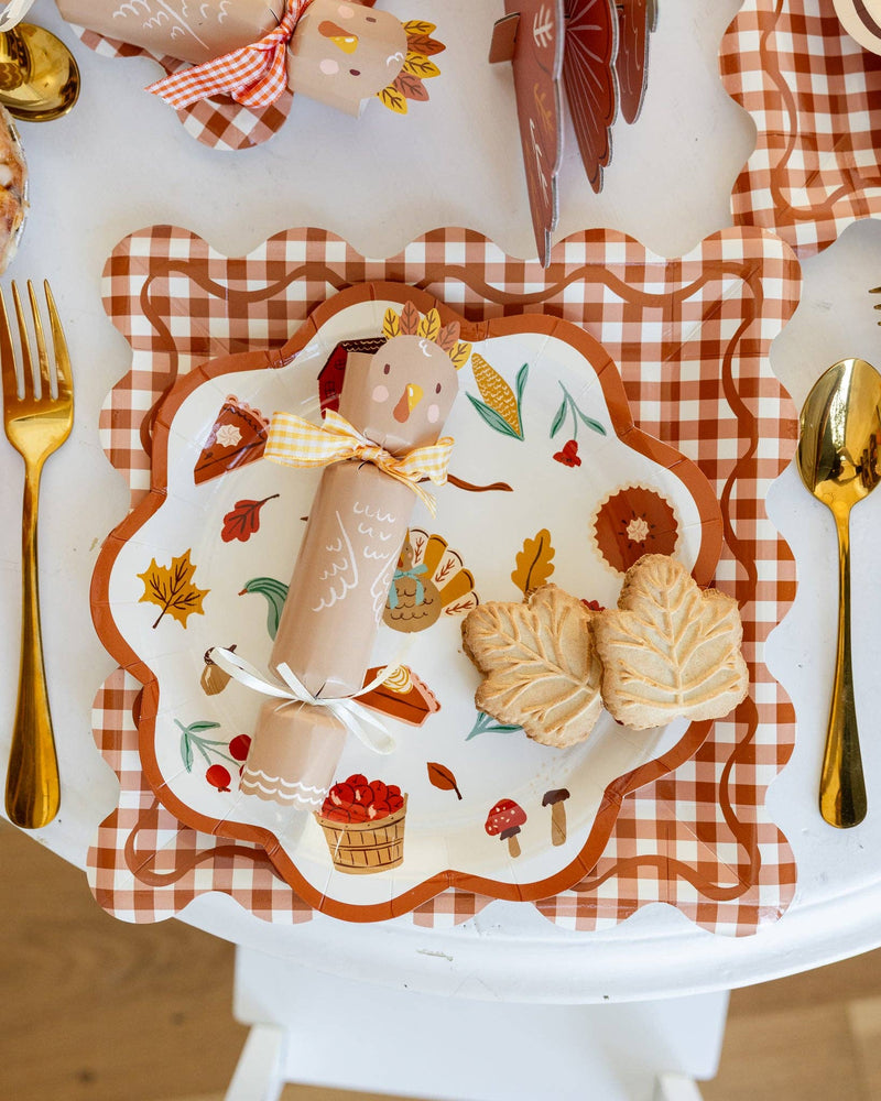 Harvest plate on a styled Thanksgiving table with autumn themed food and the matching decorations.