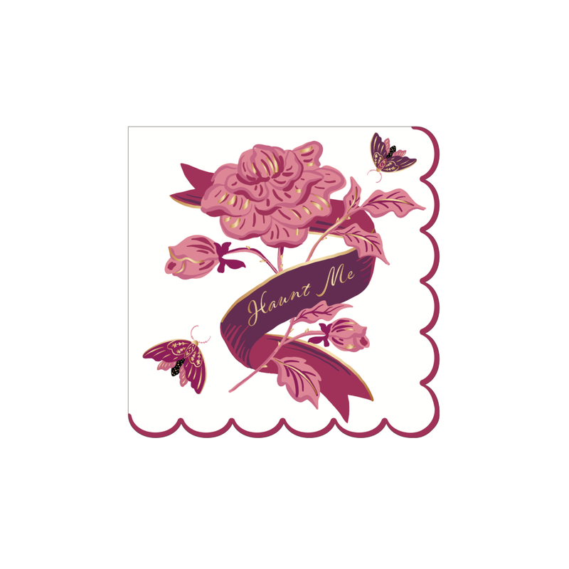 White gothic cocktail napkin with a pink rose, gold-foil moths, a "Haunt Me" gold script banner, and a scalloped magenta edge, on a white background.