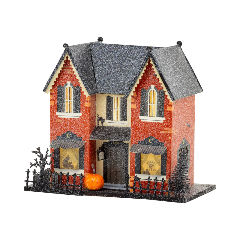Madame Mystic light up haunted house Halloween village in red brick glitter with gravestones, black cat window and iron fence