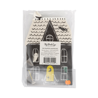 Back of the retail package: a clear bag with a product label reading "24 Paper Napkins • Spooky House • SPS1337"; the die-cut haunted house napkin shows a cream wave-shingled roof with chimney, black facade, ghost window, yellow lit door with a spider, broom, and pumpkin. Straight-on packaging shot.