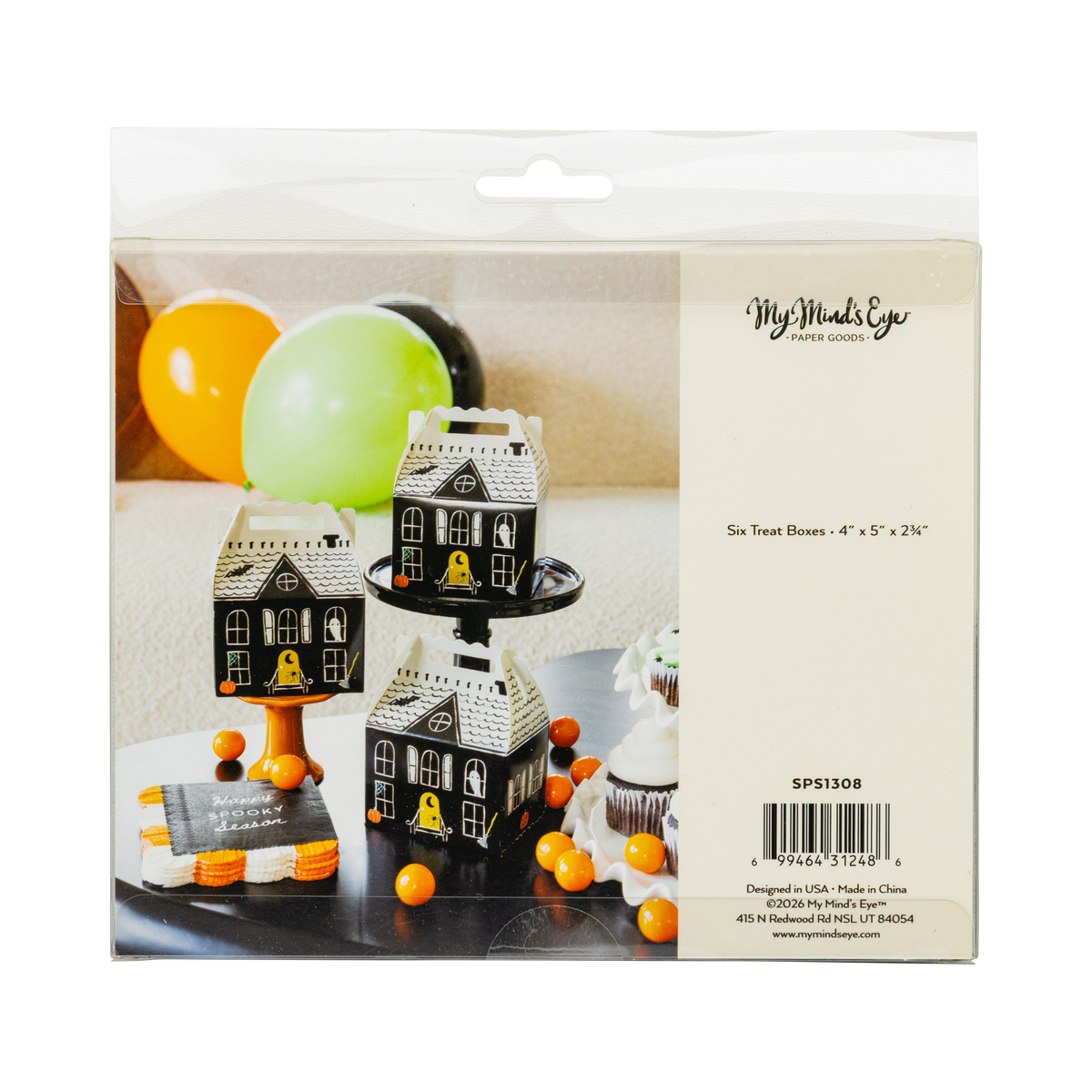 Back of the retail package: clear bag with a product label reading "Six Treat Boxes • 4" x 5" x 2¾"" and item number SPS1308, with a cover photo of three assembled houses among balloons. Straight-on packaging shot.