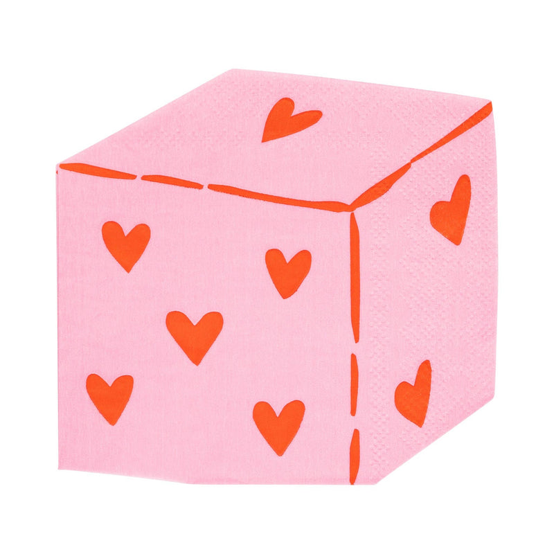 Pink dice-shaped napkin with red heart pips.