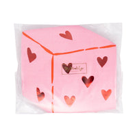 Packaged heart dice napkins with red foil details visible.