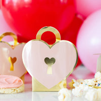 Heart lock treat box displayed on Valentine dessert table with sweets