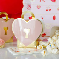 Heart lock treat box filled with popcorn and treats at Valentine celebration