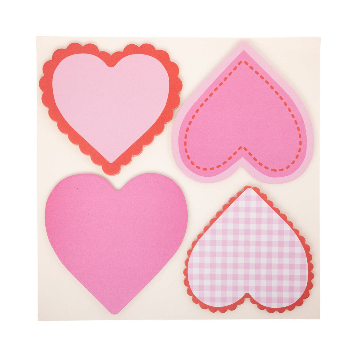 Four heart-shaped adhesive notes in pink and red with scalloped and gingham designs