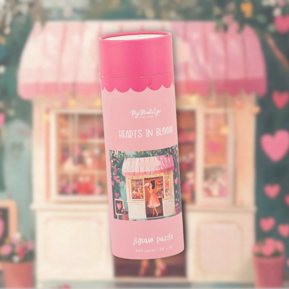 Hearts in Bloom jigsaw puzzle packaged in a pink cylindrical tube