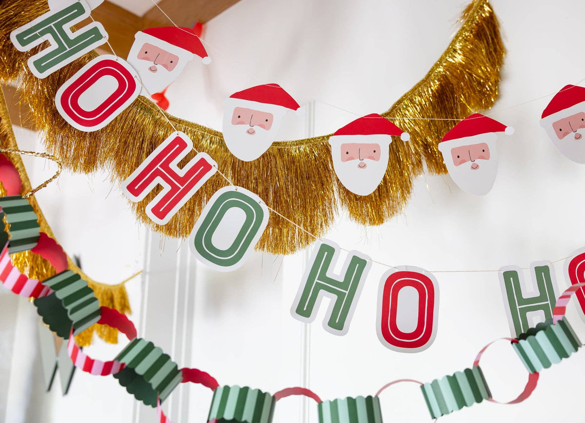 Ho Ho Ho Santa banners styled with gold tinsel