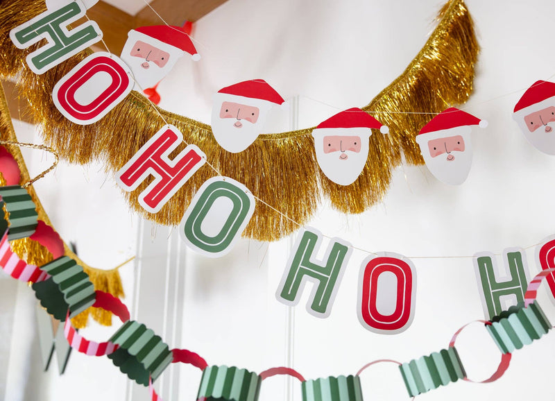 Ho Ho Ho Santa banners styled with gold tinsel