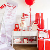 Full holiday table display showing the stacked Red Star Plates with other coordinating holiday tableware and decor.