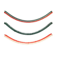 Three honeycomb Christmas garlands — green tree, red-and-green wreath, and red-and-cream bell — stacked on a white background.