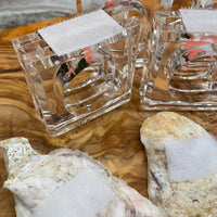 Bring the beach to your table settings with our Oyster Shell Napkin Rings. These napkin rings are the perfect addition to your tropical table decor, featuring real oyster shells finished in a shiny epoxy and mounted to acrylic rings with convenient velcro. Ideal for those who love a bit of the coastal vibe in their dining decor.