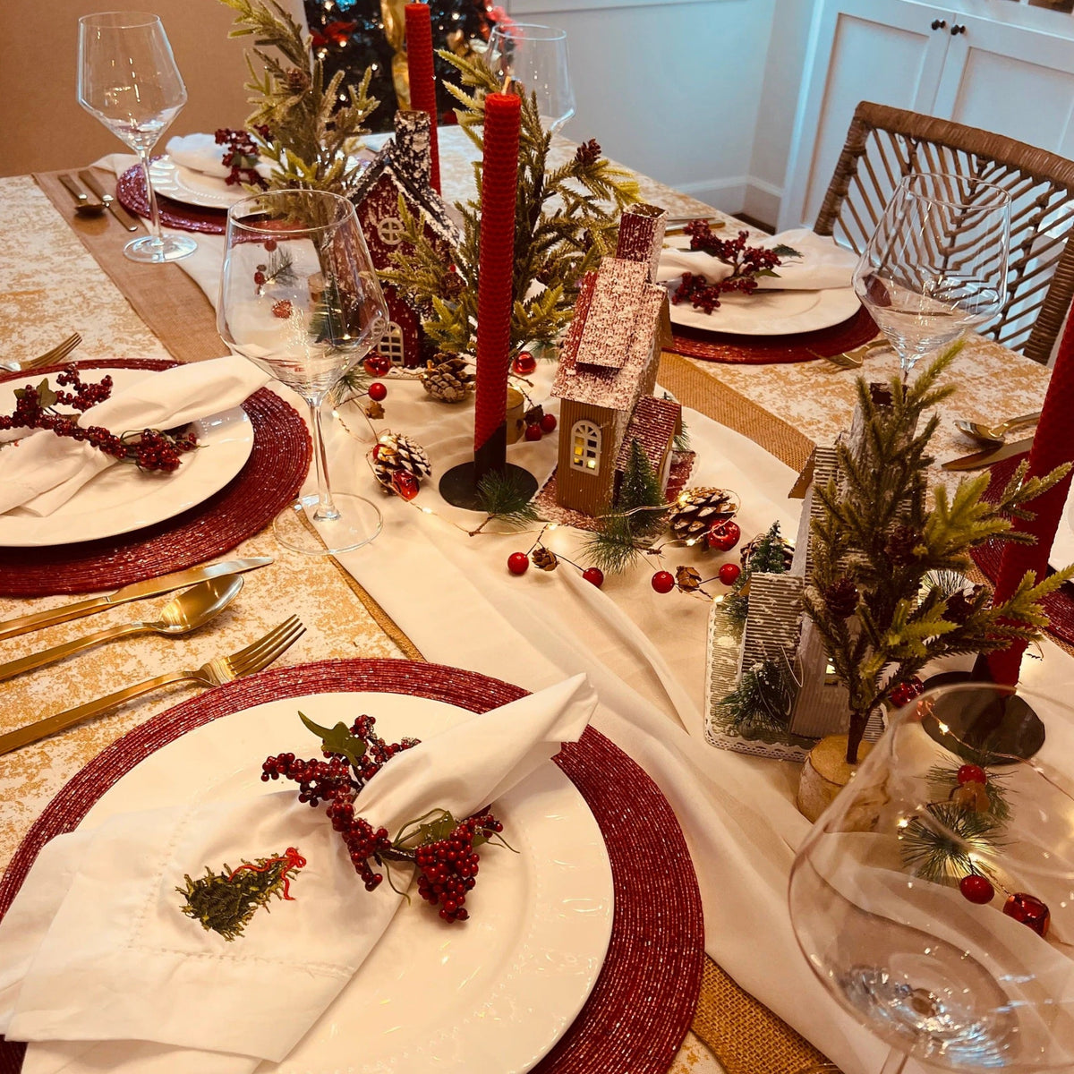 Gold and White tablecloth on a Christmas table setting.