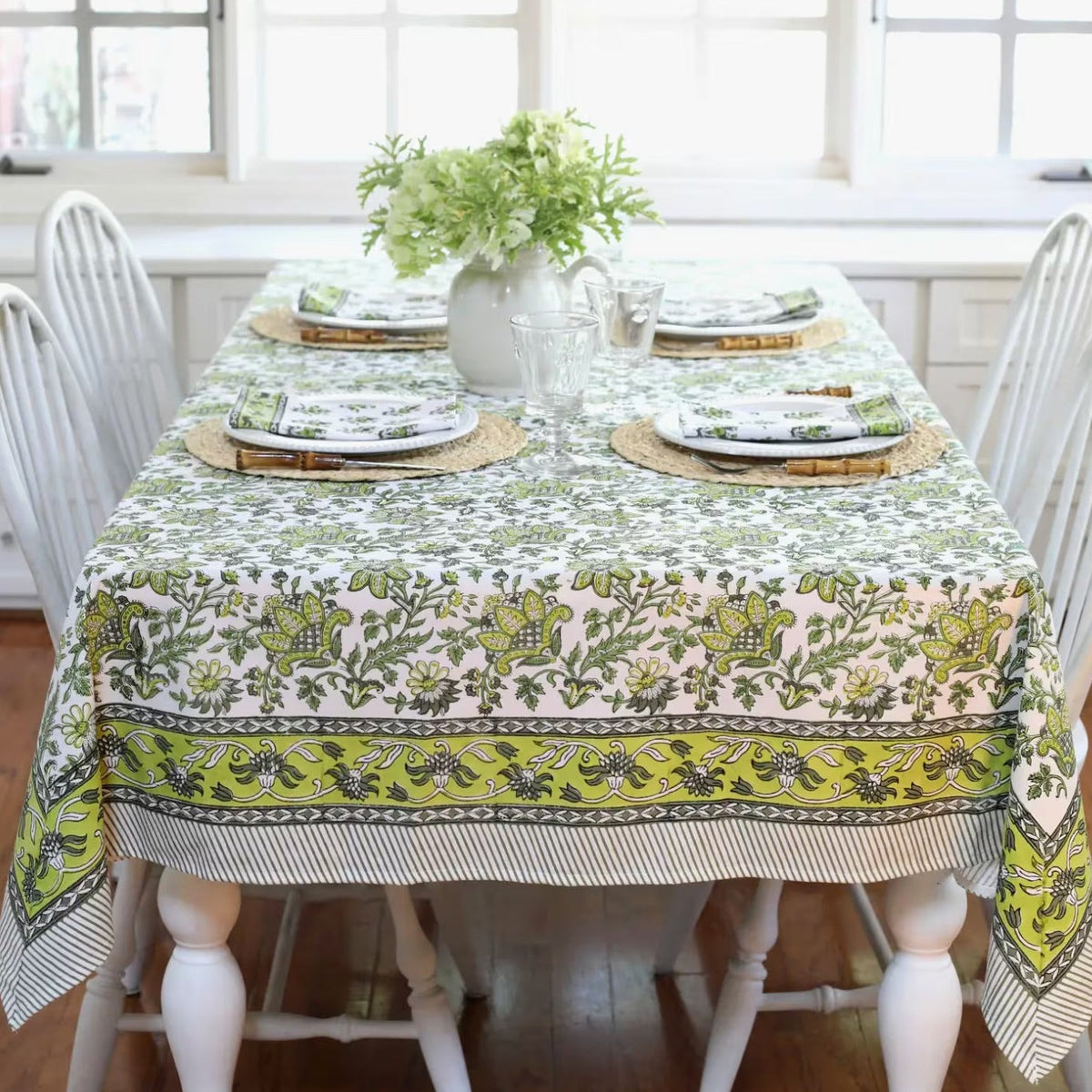Discover the perfect backdrop for your summer celebrations with our Green Floral Tablecloth. Measuring 60"x 92", this tablecloth combines practicality with style, making it an essential addition to your garden party decor. Made from soft, durable cotton with a vibrant green and white block print, it’s not just a tablecloth—it’s a part of the party. Your guests will love this eye-catching floral tablecloth.