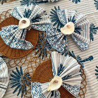 Bring the beach to your table settings with our Oyster Shell Napkin Rings. These napkin rings are the perfect addition to your tropical table decor, featuring real oyster shells finished in a shiny epoxy and mounted to acrylic rings with convenient velcro. Ideal for those who love a bit of the coastal vibe in their dining decor.