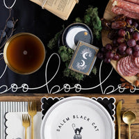 Black paper table runner with white wording boo - perfect for a halloween table. 