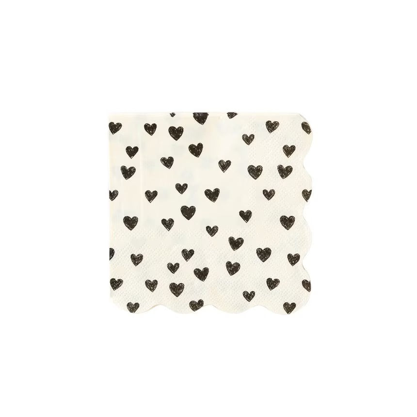 White paper cocktail napkins with small black hearts and scalloped edges - perfect for valentines day, galentines day or an anniversary party