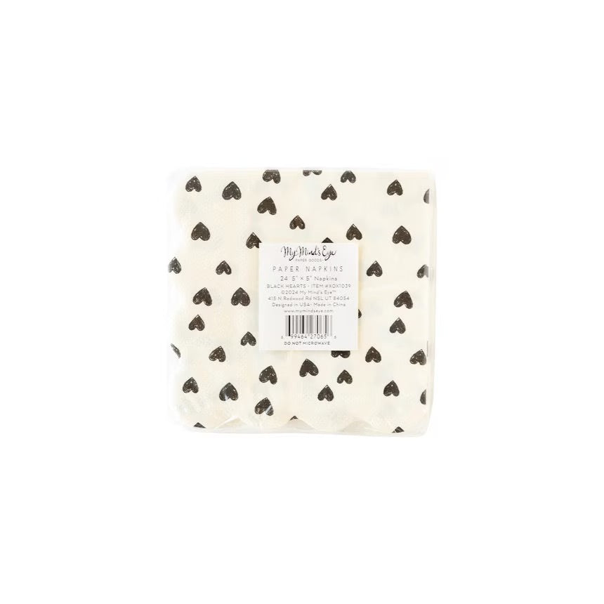 White paper cocktail napkins with small black hearts and scalloped edges - perfect for valentines day, galentines day or an anniversary party
